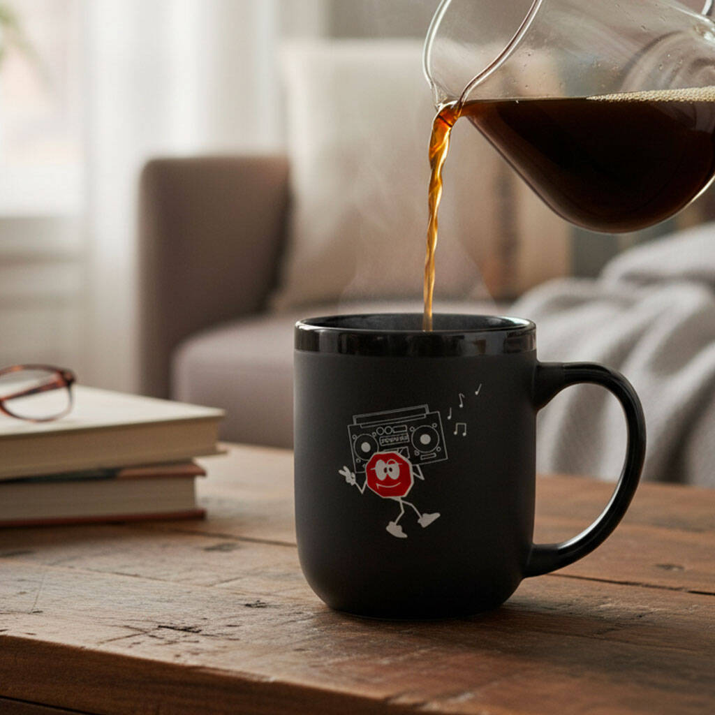 Coffee being poured into the Ground Central Boombox Mug on a wooden table