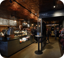 Inside a Ground Central café, with the coffee bar and pastry case