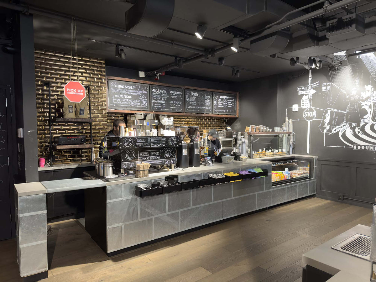 Service counter with espresso machine and pastry case at GC Grand Central Station