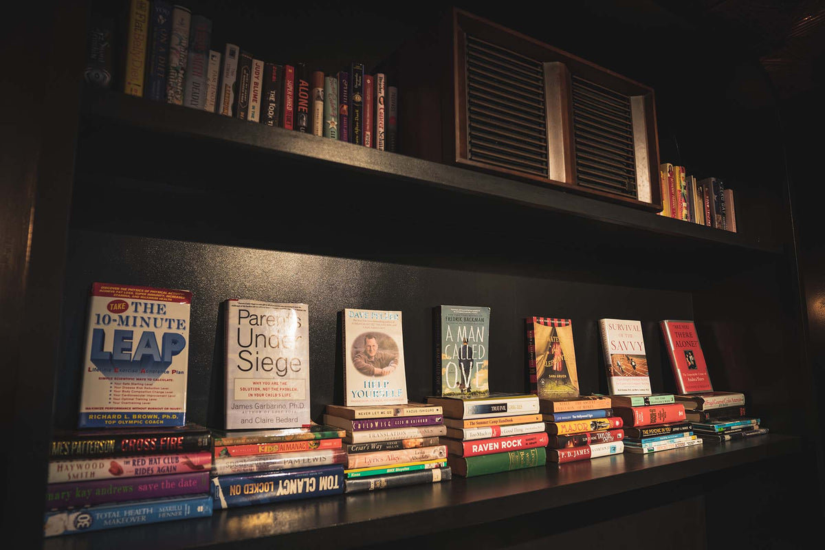 Shelves of books lining the wall at GC Murray Hill