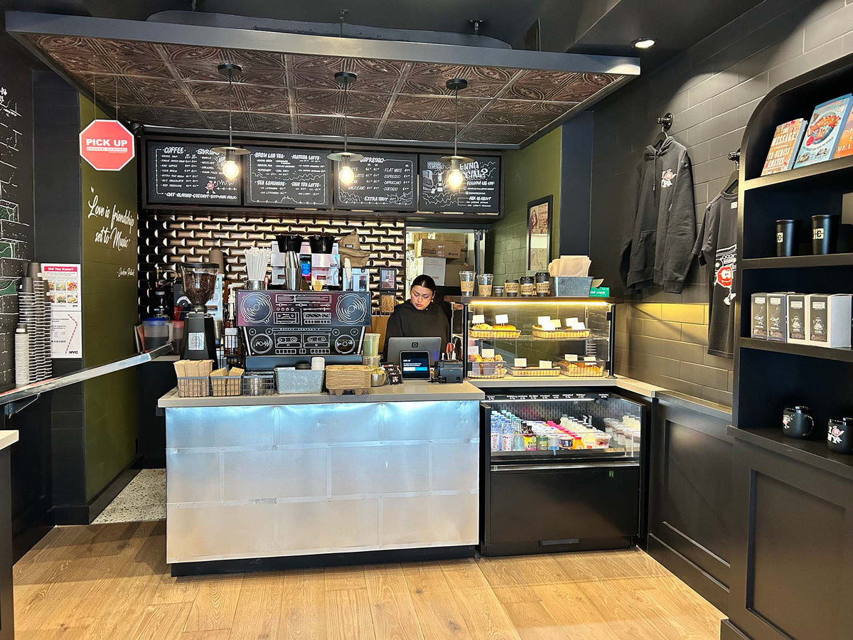 Pastry case and retail shelves along the counter at GC Turtle Bay