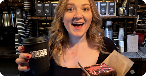 Ground Central barista serving a customer with a smile