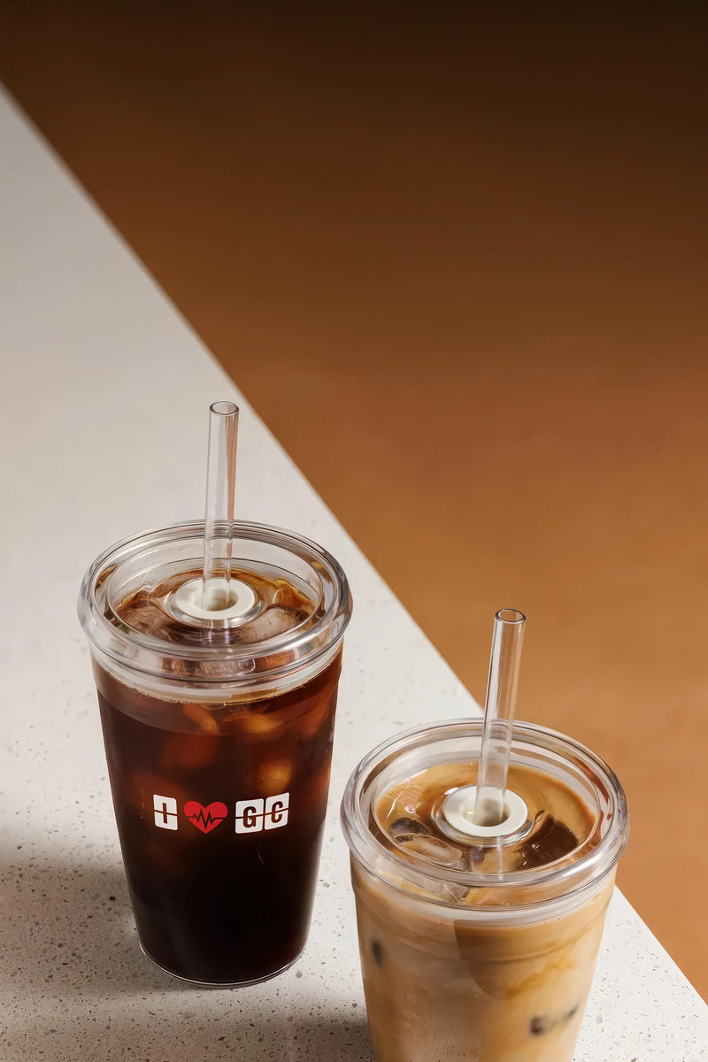 Two I Love GC Cold Cups with iced coffee and an iced latte on a counter